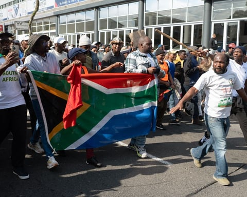 Demonstrators protest against undocumented migrants in Cape Town as anti-migrant violence spreads in South Africa