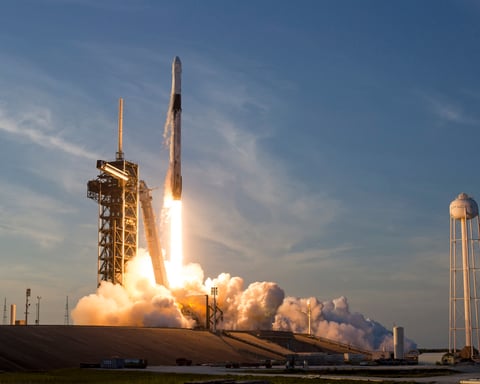 SpaceX Falcon 9 rocket lifting off from Kennedy Space Center ahead of the company's record Nasdaq IPO