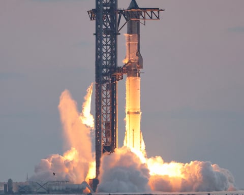 SpaceX's Starship rocket igniting its engines at liftoff in a cloud of flame and exhaust
