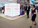 Delegates walk through the exhibition hall at the 29th St. Petersburg International Economic Forum, June 2026
