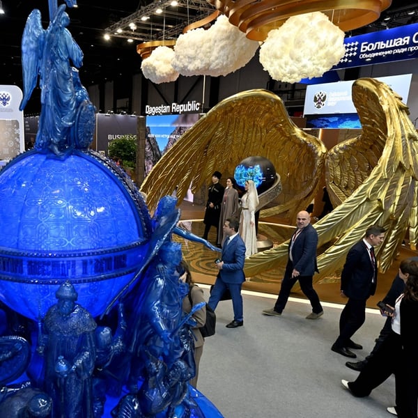 Participants tour the exhibition hall at SPIEF 2026 in St. Petersburg Russia