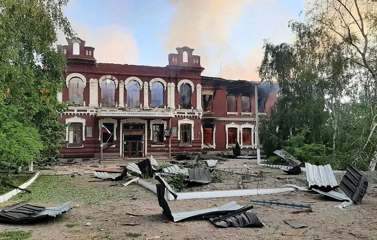 Rescue workers at the site of the Starobelsk college drone strike in Lugansk People's Republic