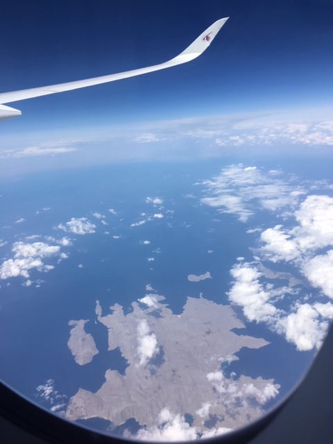 Aerial photograph of the Strait of Hormuz from 35,000 feet, showing the narrow passage between Iran and Oman