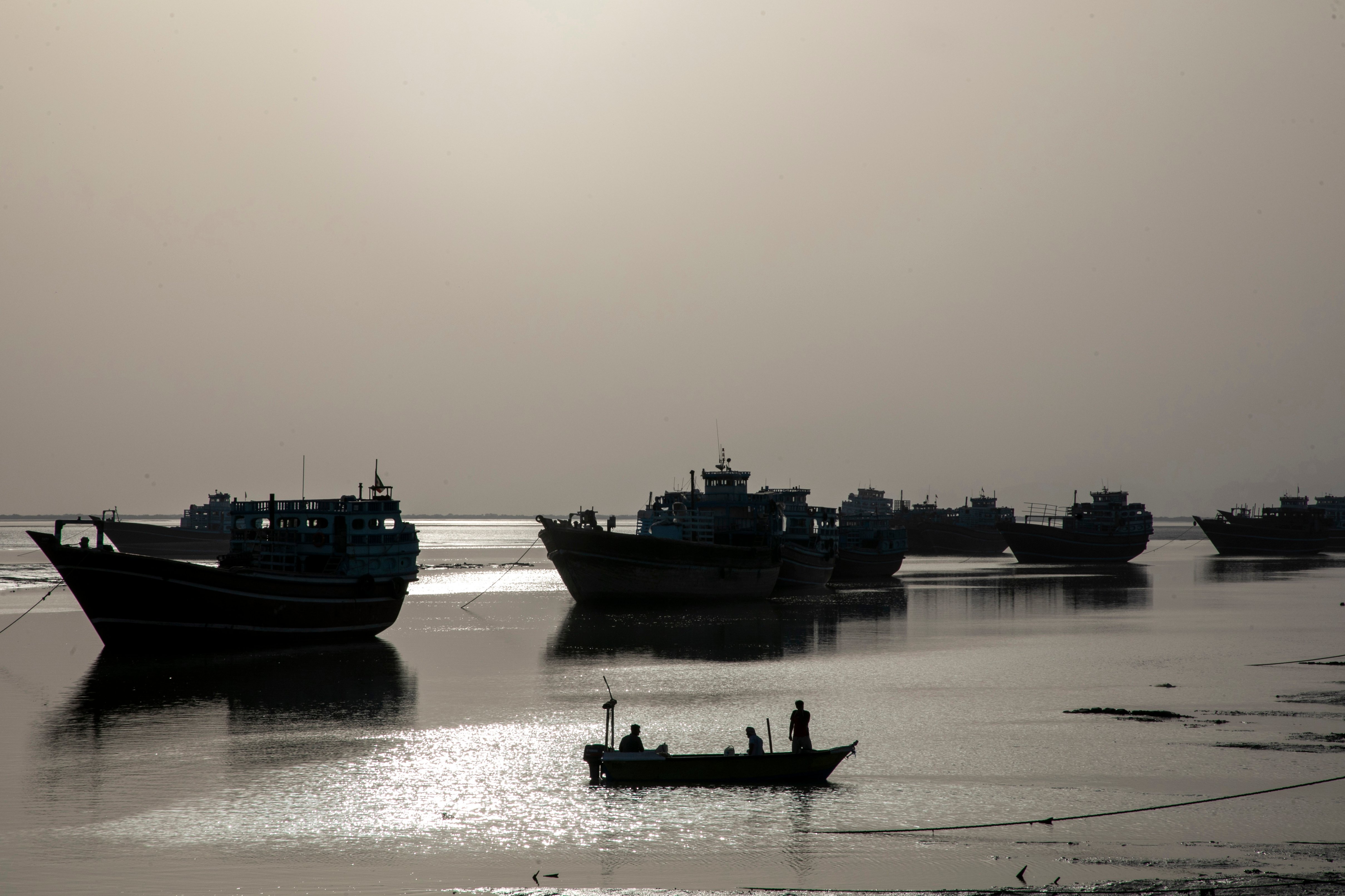 Fishing boats along the Strait of Hormuz, where US strikes on Iranian ports triggered Iran's retaliation against Bahrain and Kuwait