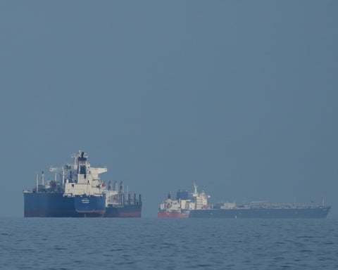Oil tankers and cargo ships anchored in the Strait of Hormuz near Khor Fakkan, United Arab Emirates