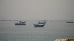 Vessels anchored in the Strait of Hormuz seen from Oman as Pakistan confirms the US-Iran peace deal text is final