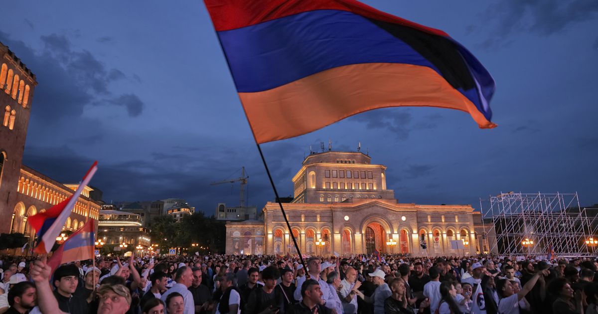 Supporters of Samvel Karapetyan wave Armenian flags at a Strong Armenia rally in Yerevan Republic Square June 3 2026