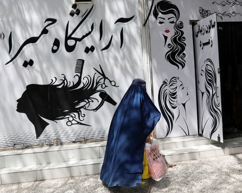 Afghan women in Herat under Taliban morality enforcement of mandatory hijab and burqa rules