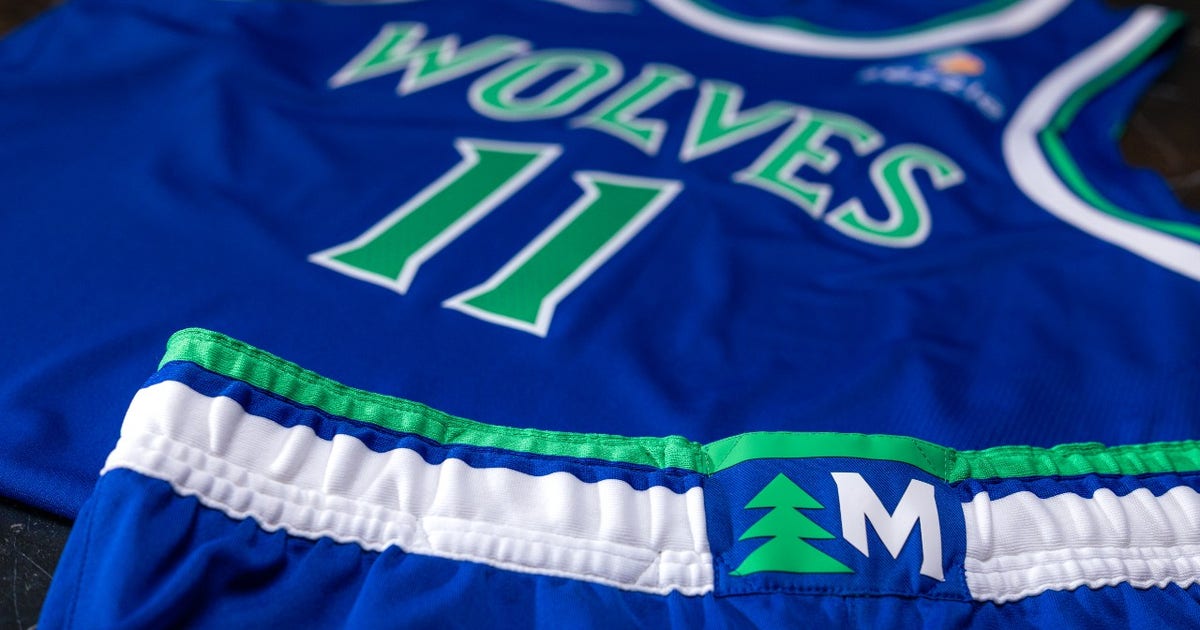 Minnesota Timberwolves players model the new pine tree uniforms for the 2026-27 NBA season