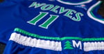 Minnesota Timberwolves players model the new pine tree uniforms for the 2026-27 NBA season