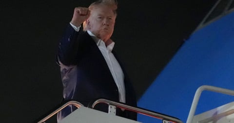 President Donald Trump gestures as he boards Air Force One at Joint Base Andrews for the G7 summit in France June 15 2026