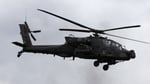 US Army AH-64 Apache helicopter patrolling near the Strait of Hormuz during Iran war operations 2026