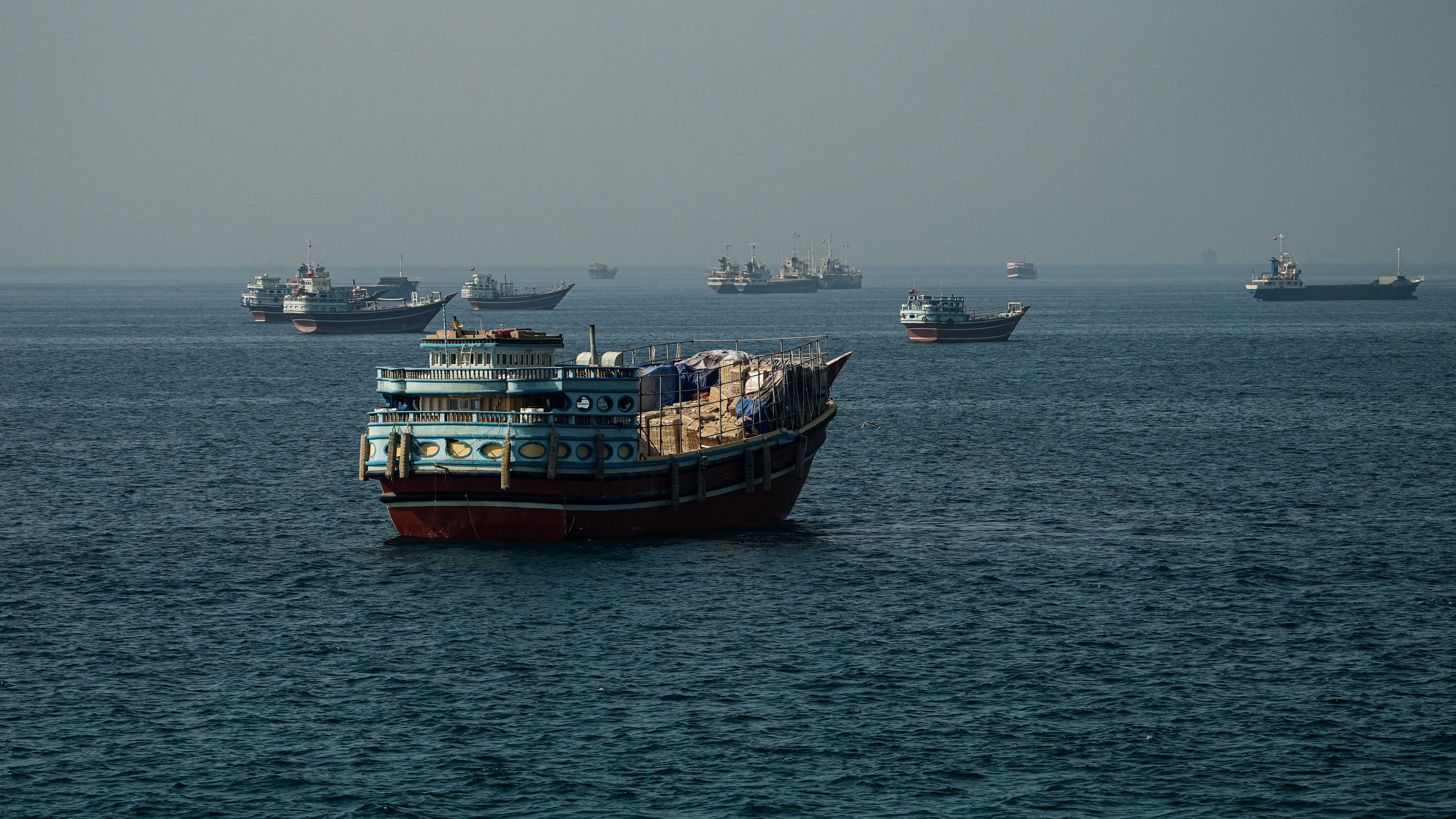 Vessels anchored in the Strait of Hormuz off Bandar Abbas as US-Iran peace negotiations stall
