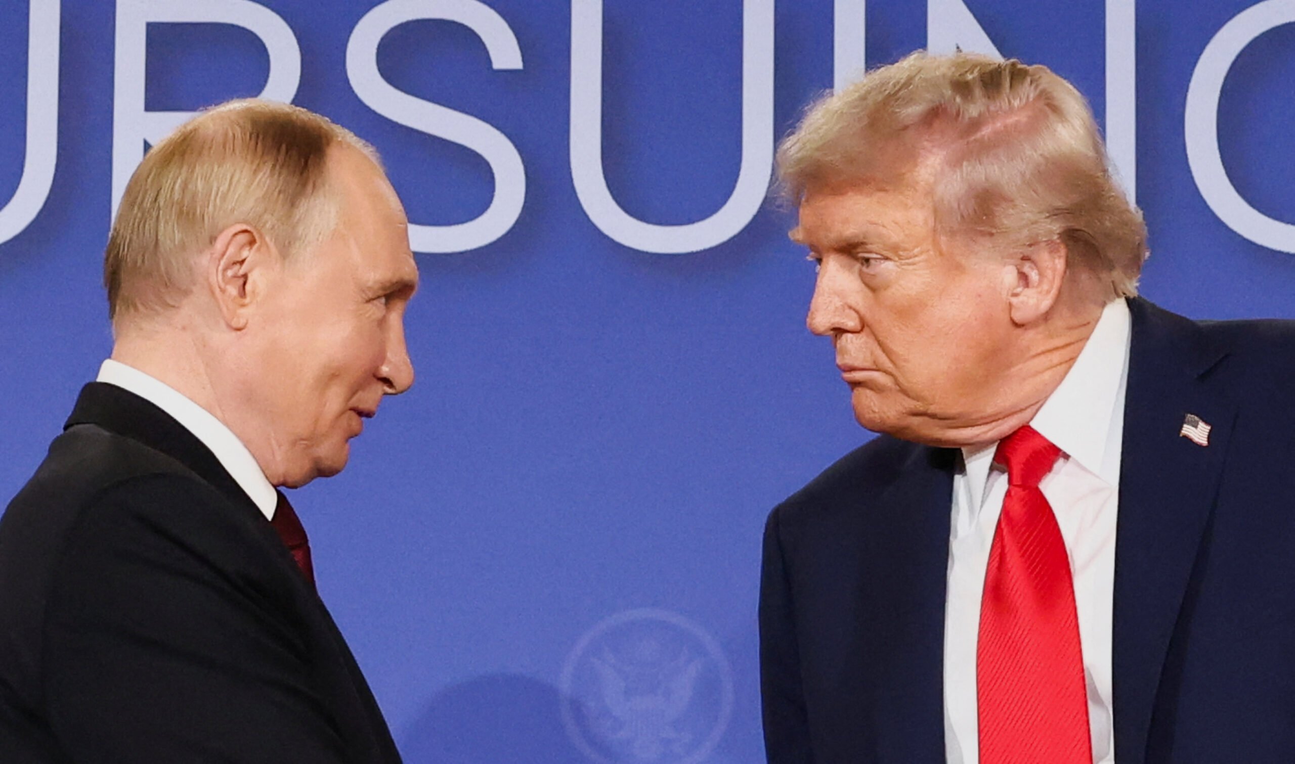 US President Donald Trump and Russian President Vladimir Putin look at each other during a press conference following their meeting in Anchorage, Alaska, August 15, 2025