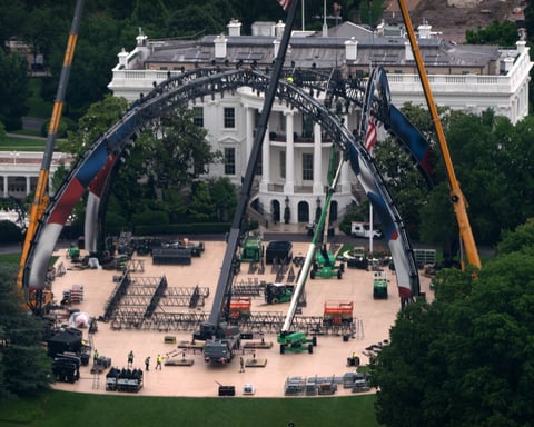Construction crew erects the UFC octagon cage on the South Lawn of the White House for UFC Freedom 250