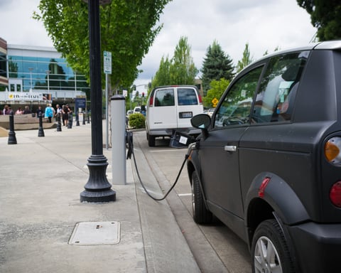 A UK electric vehicle charging station as battery EV annual sales outpace petrol for the first time