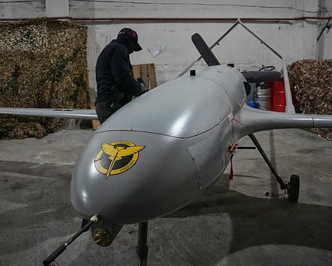 A Ukrainian serviceman prepares a long-range drone for deployment against Russian naval targets, June 2026