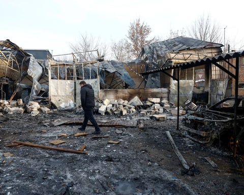 Emergency workers at the site of a strike in Kyiv, Ukraine