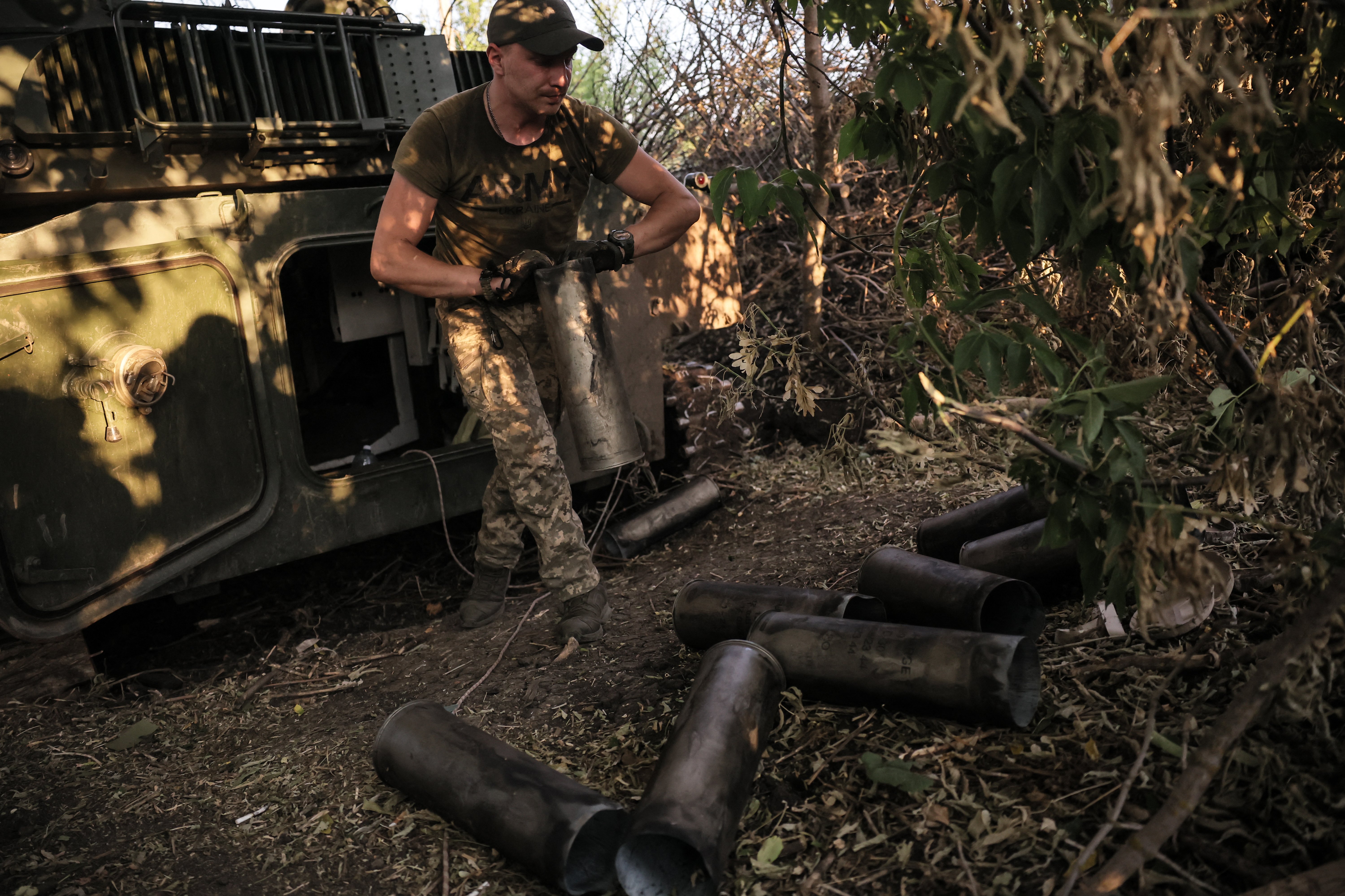 Ukrainian soldier operating a 122mm self-propelled howitzer at the frontline in Donetsk region during the Russian operation in Ukraine