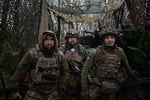 Ukrainian soldier from 148th Artillery Brigade walks along trench at Pokrovsk front-line position Donetsk Oblast January 2026 as Russia seizes Khimik DPR