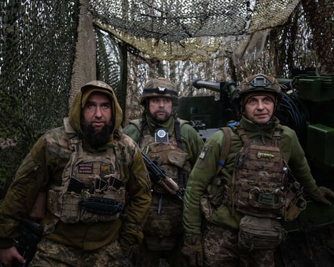 Ukrainian soldier from 148th Artillery Brigade walks along trench at Pokrovsk front-line position Donetsk Oblast January 2026 as Russia seizes Khimik DPR