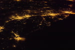 NASA astronaut photograph from the International Space Station of the United States Atlantic Seaboard at night with Boston, New York, Philadelphia, Baltimore, and Washington DC visible as connected bright urban regions