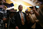 A US senator speaks to reporters outside the Senate chamber at the US Capitol in Washington
