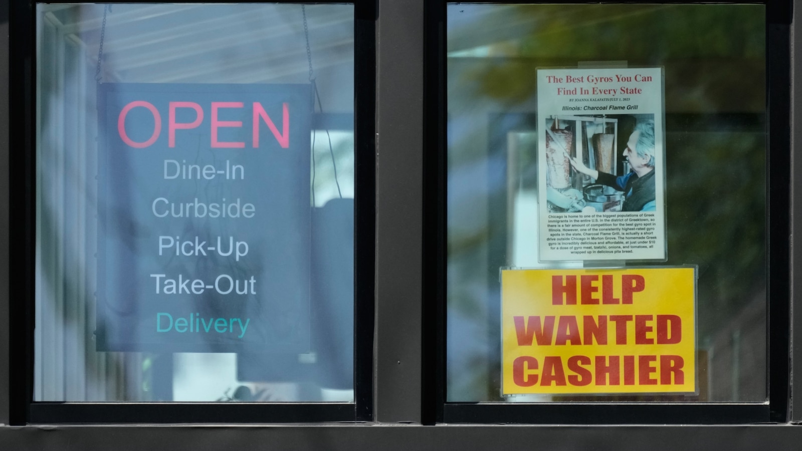 A hiring sign displayed at a restaurant in Morton Grove Illinois as US weekly jobless claims hit 225000 highest since February 2026