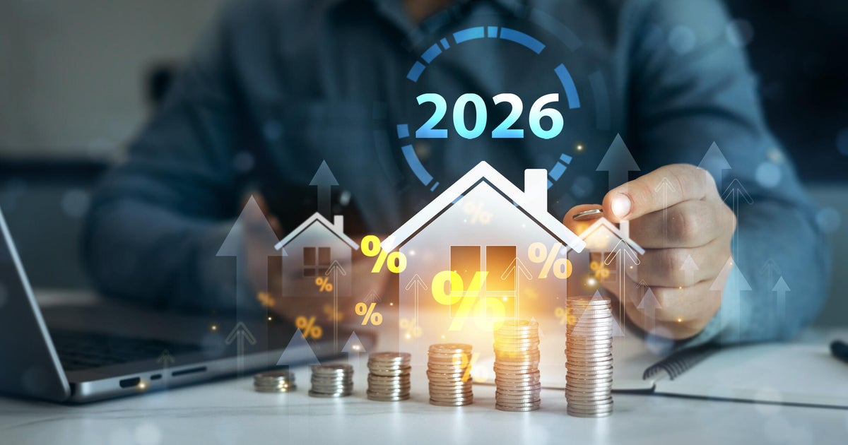 Homebuyer reviewing mortgage rates documents in 2026 as US 30-year fixed rate falls to 6.48 percent