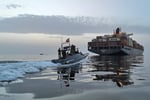Iranian Revolutionary Guard fast boat in the Strait of Hormuz as US strikes test the Iran ceasefire