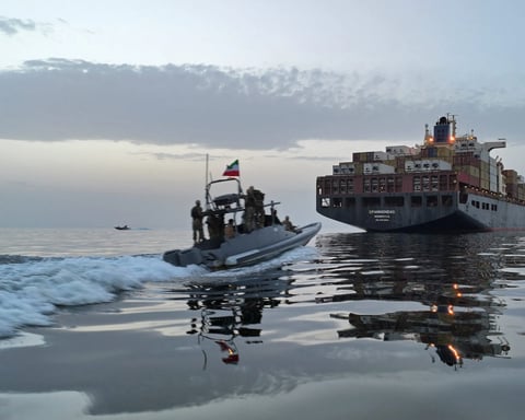 Iranian Revolutionary Guard fast boat in the Strait of Hormuz as US strikes test the Iran ceasefire