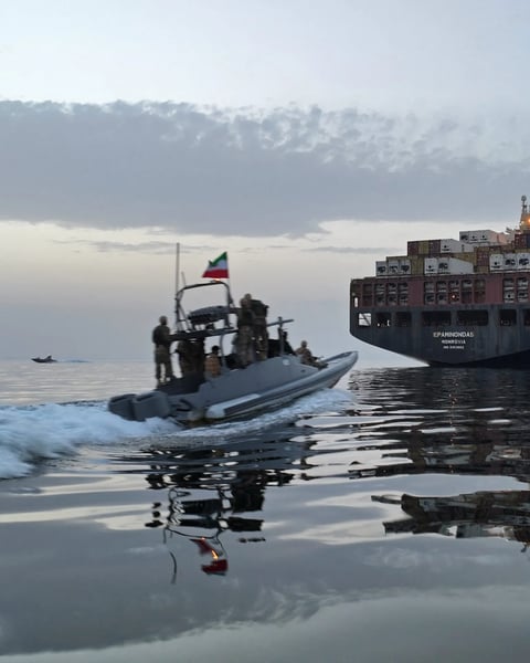 Iranian Revolutionary Guard fast boat in the Strait of Hormuz as US strikes test the Iran ceasefire