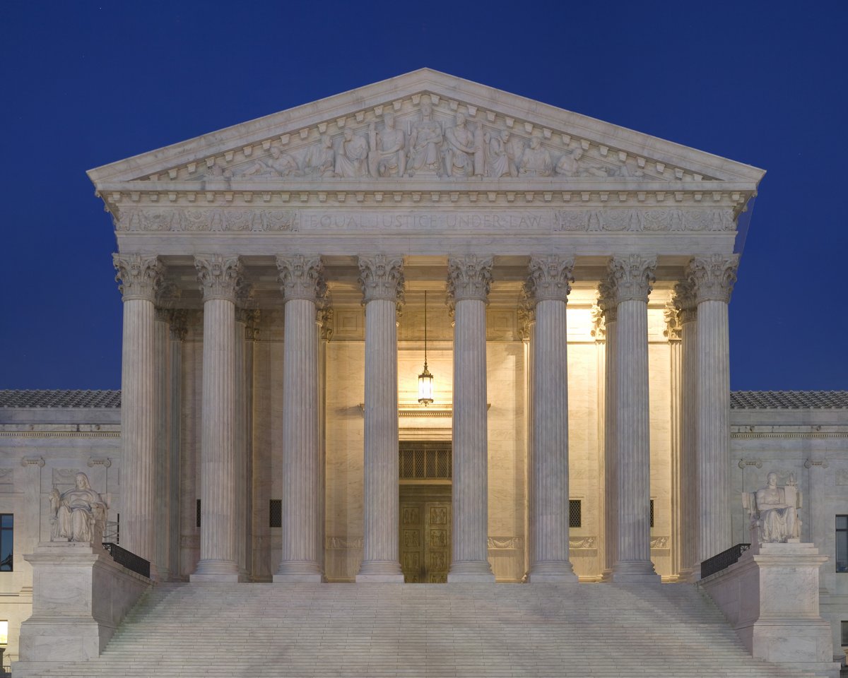 The United States Supreme Court building in Washington DC at dusk
