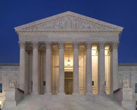 The United States Supreme Court building in Washington D.C. at dusk, where the Wolford v. Lopez Hawaii gun ruling was handed down