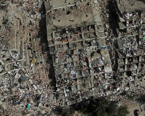 Rescue workers search through rubble after earthquake strikes Venezuela in 2026