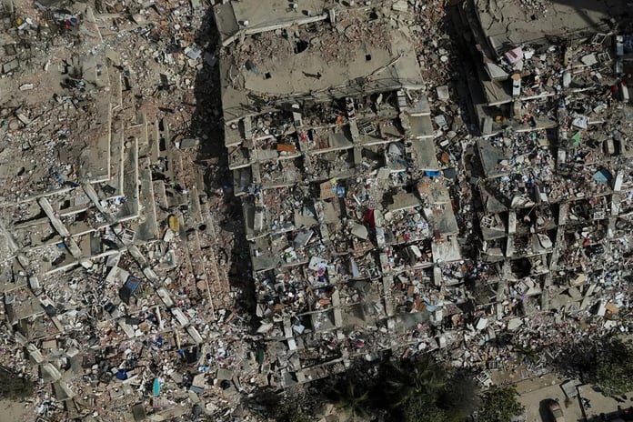 Rescue workers search through rubble after earthquake strikes Venezuela in 2026