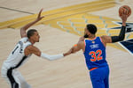 Victor Wembanyama defends Karl-Anthony Towns during Game 2 of the 2026 NBA Finals at Frost Bank Center