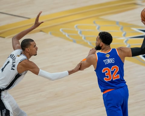 Victor Wembanyama defends Karl-Anthony Towns during Game 2 of the 2026 NBA Finals at Frost Bank Center
