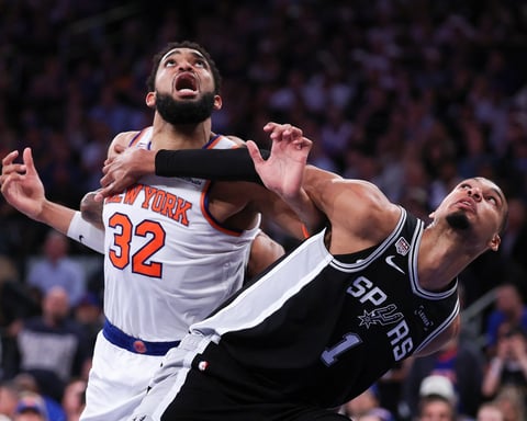 Victor Wembanyama of the San Antonio Spurs battles Karl-Anthony Towns of the New York Knicks during Game 3 of the 2026 NBA Finals