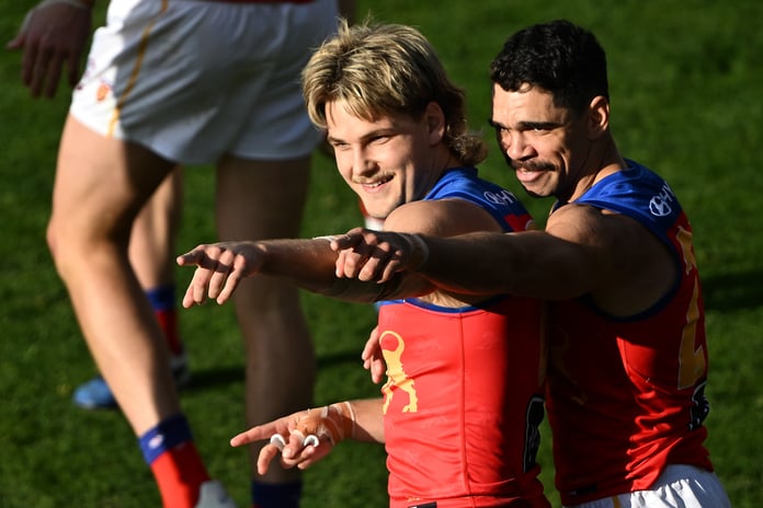 Will Ashcroft and Charlie Cameron celebrate a goal for Brisbane Lions against Richmond Tigers at Ninja Stadium Hobart Round 14 2026