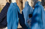 Women in burqas with their children on a street in Herat, Afghanistan, in a file photo