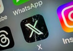 X app icon on smartphone screen showing React with Video feature coming to Android and iOS