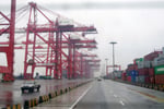 Stacked shipping containers and cranes at Yangshan deep-water port in Shanghai, China