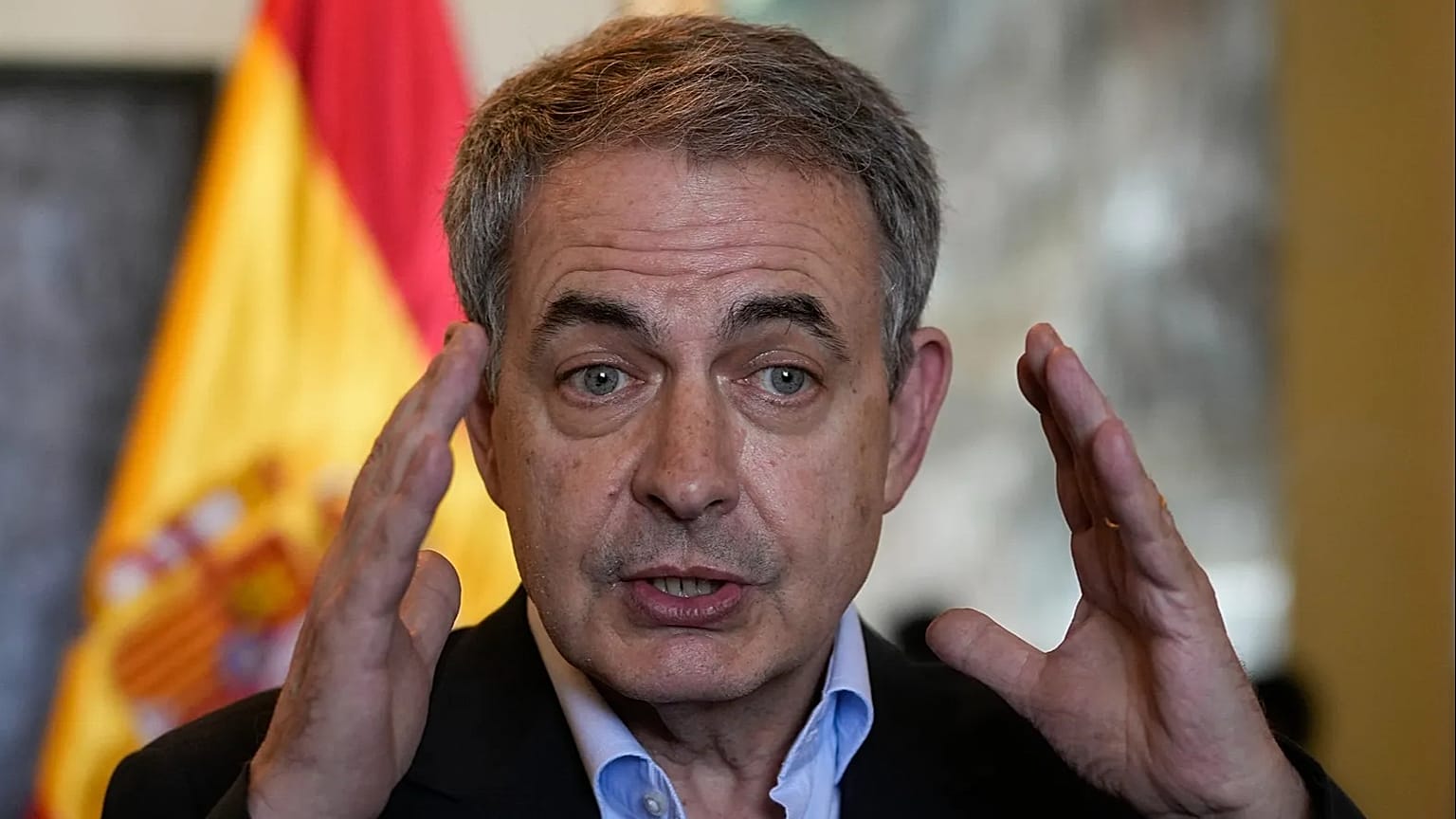 Former Spanish prime minister Jose Luis Rodriguez Zapatero speaks to journalists