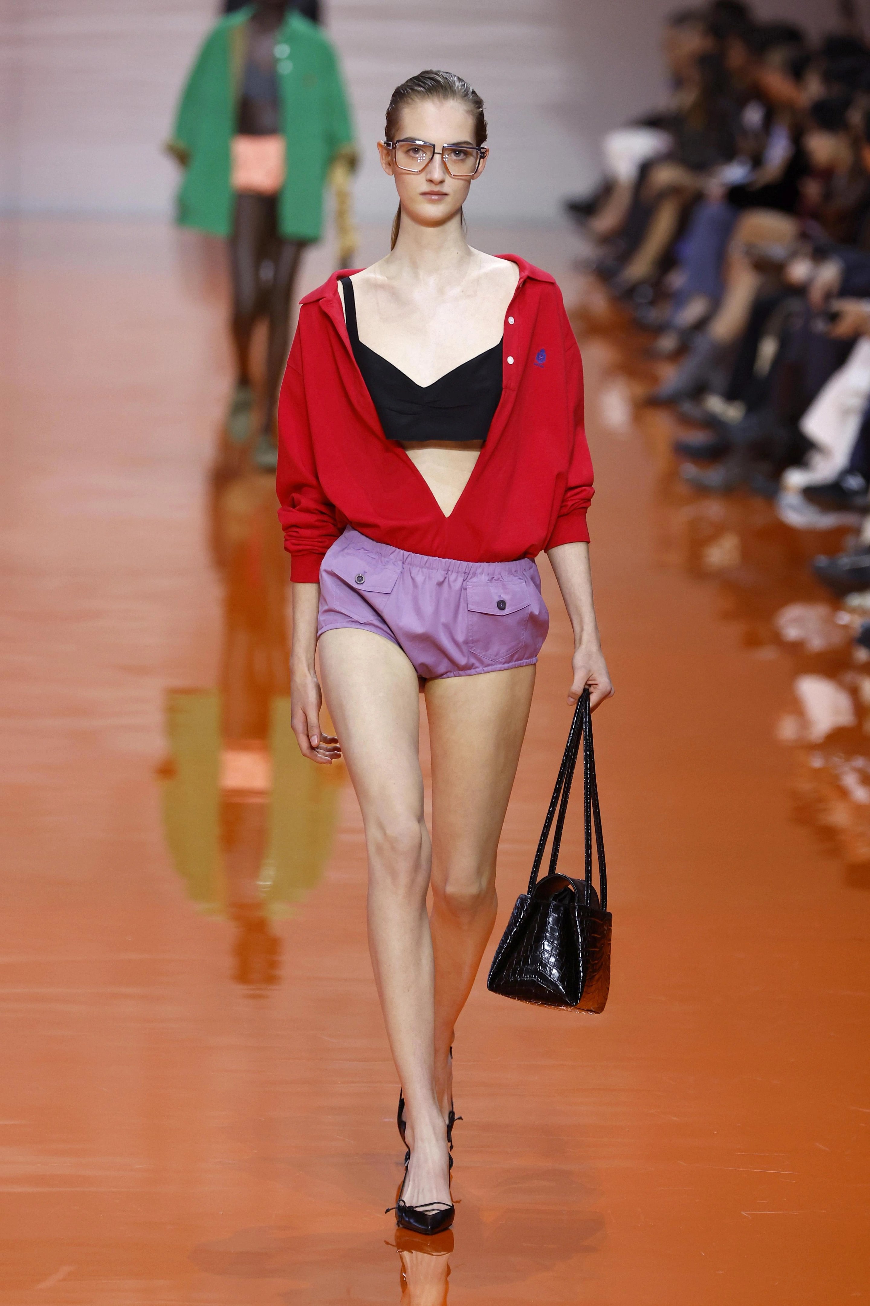 Prada spring-summer 2026 red polo shirt with purple shorts color-blocking look