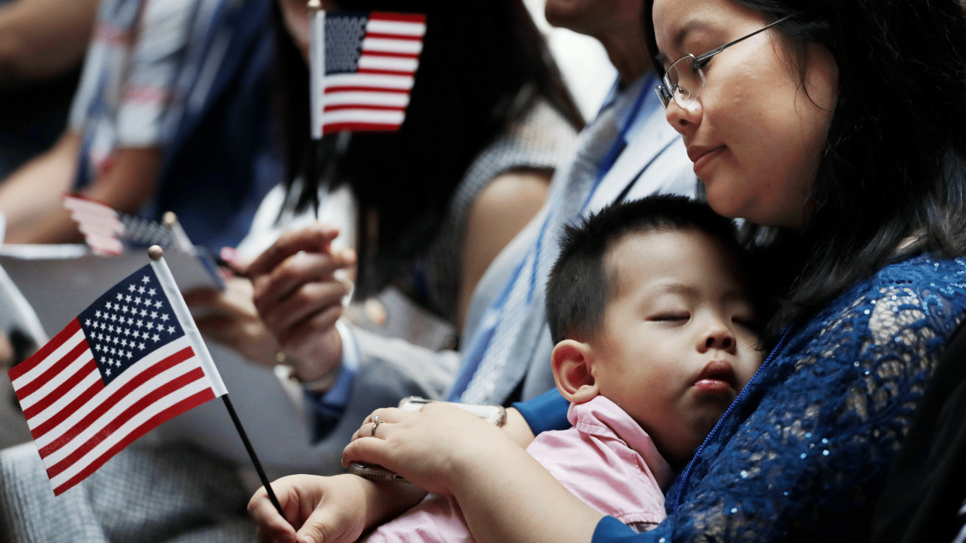 US Naturalization Ceremony — 14th Amendment Birthright Citizenship People attending a US naturalization ceremony, as birthright citizenship is upheld by the Supreme Court under the 14th Amendment