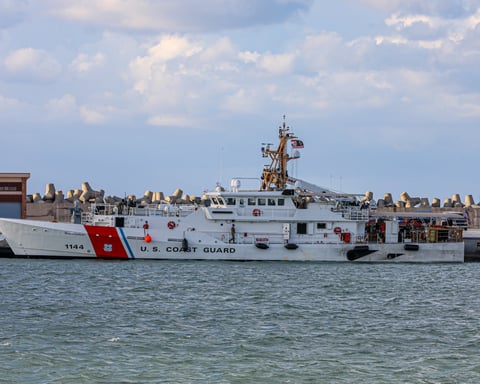 US Coast Guard Fast Response Cutter Glen Harris transiting the Strait of Hormuz with Iranian coastline in the background