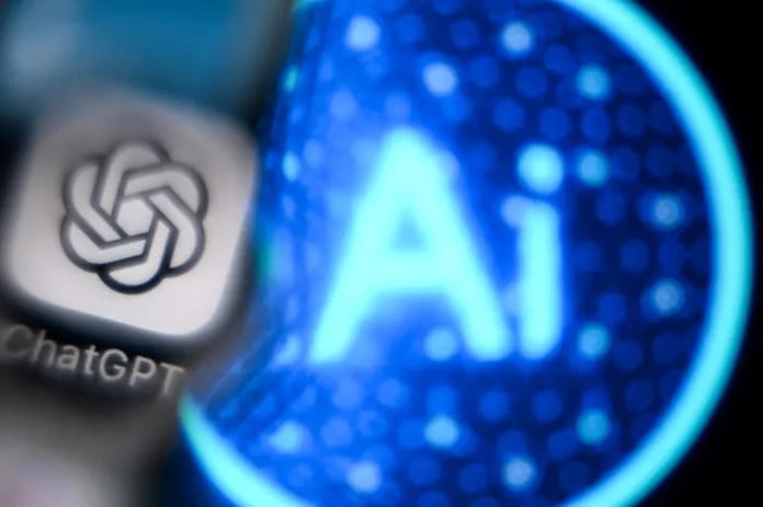 Frustrated worker at laptop as manager points to AI chatbot output on screen