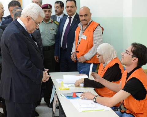 Palestinian President Mahmoud Abbas casts ballot at polling station