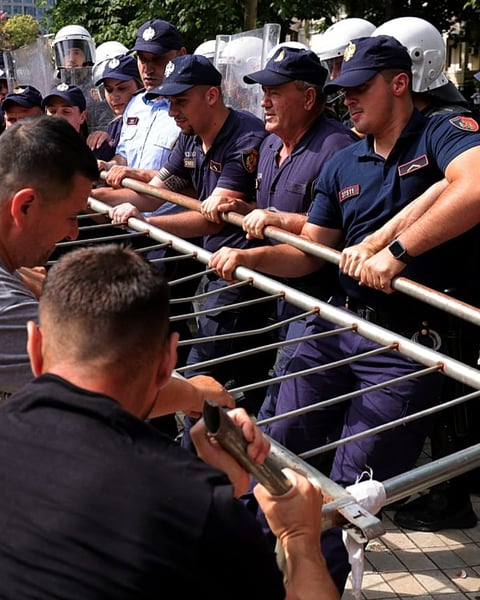 Albanian riot police deploy water cannons outside parliament building in Tirana during Kushner resort protests July 2026